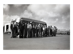 Bracero workers witing to load up onto a transport bus